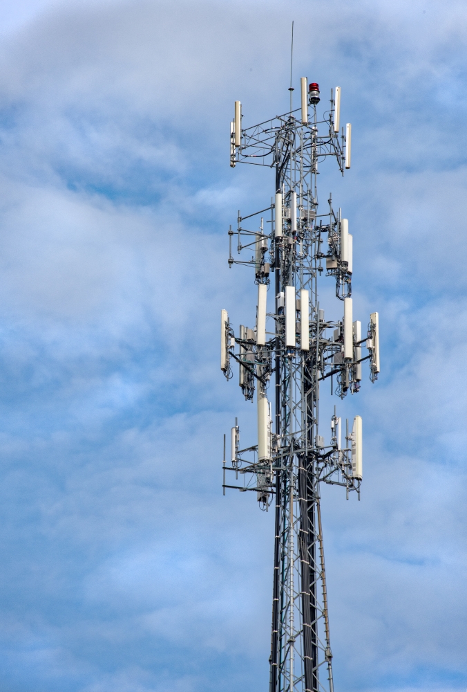 cell tower with white puffy clouds in the background photo 85025