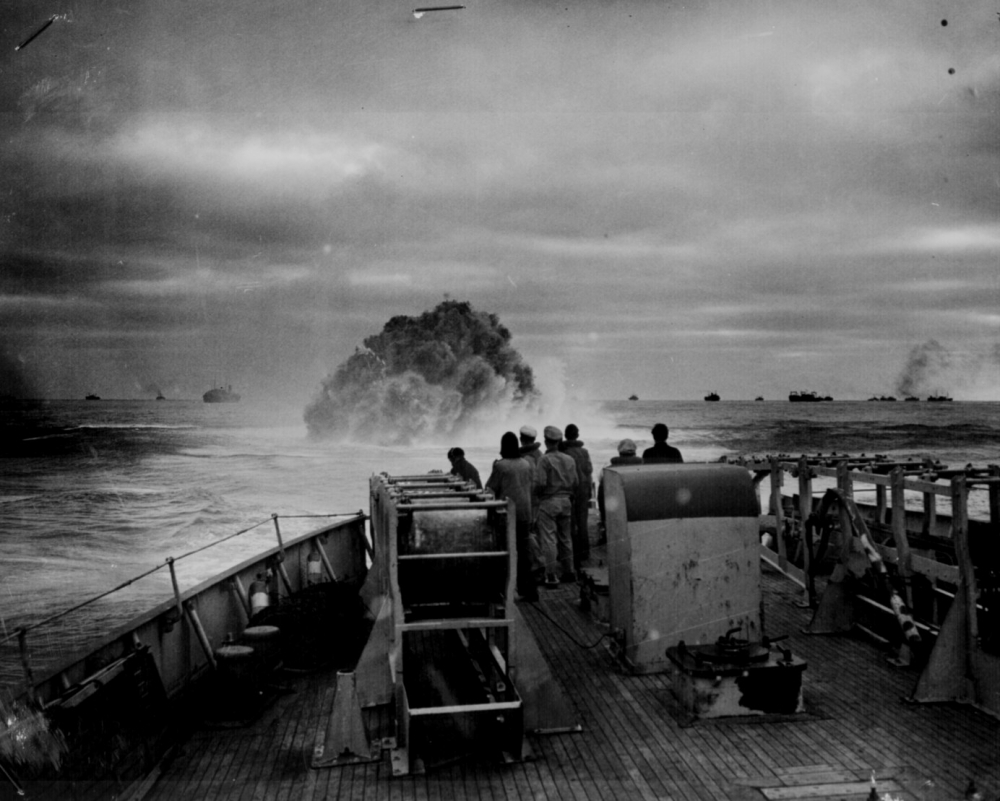 Coast Guardsmen on the deck of the U S Coast Guard Cutter