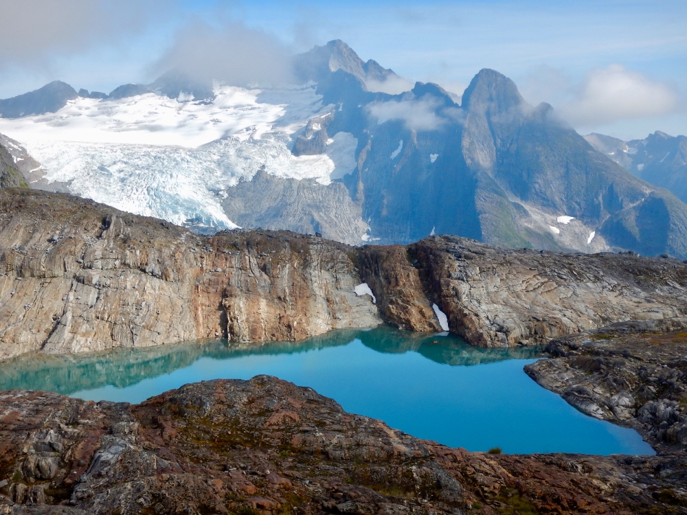 crystal tourquise lake snow capped mountains tongass National Fo