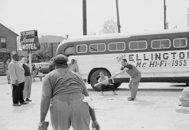 Duke Ellington and band members playing baseball in front of the