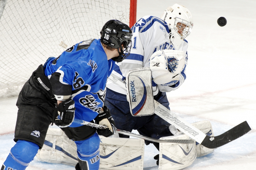 hockey player makes the save punk in air