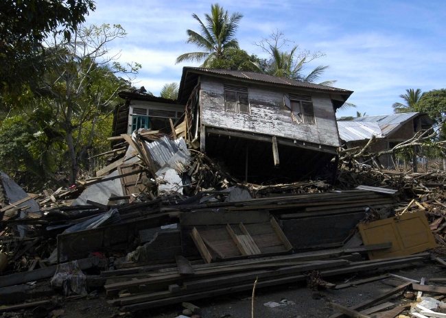 house lies nearly on its side in the region of Glebruk,