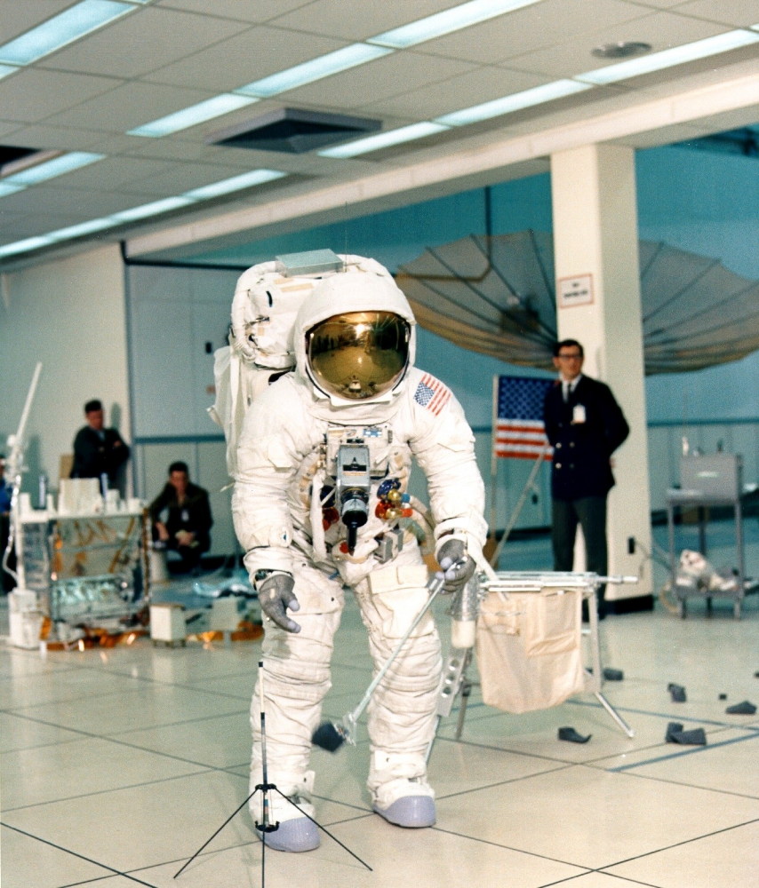 jim lovell collects a sample with the tongs during training