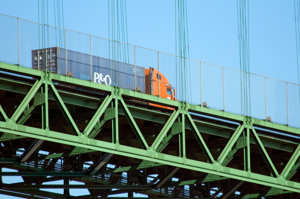 picture tractor trailor truck on bridge