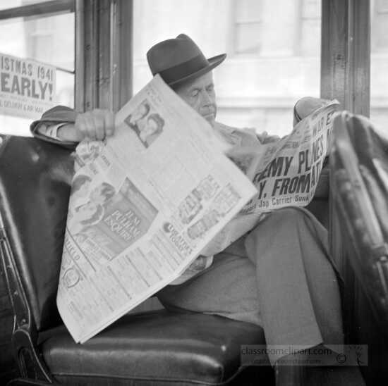 Reading war news while riding on streetcar in San Francisco 1941