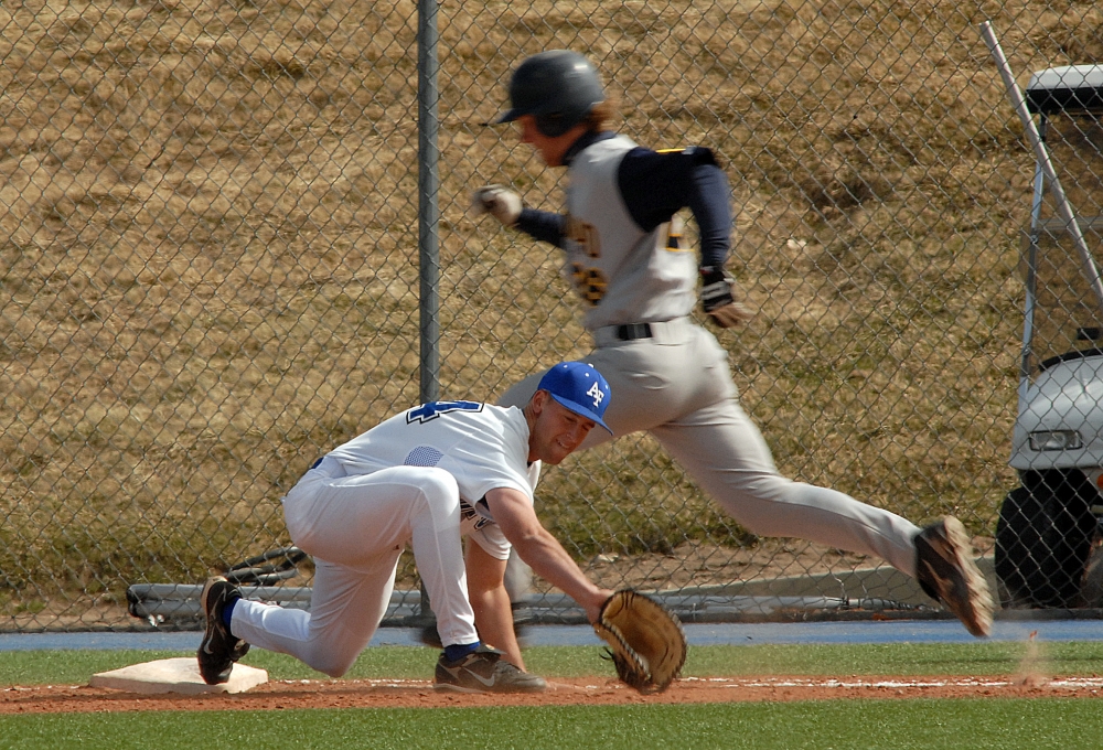 stretchs to make the put out at first