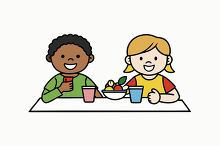 boy and girl sitting at a table in schol cafeteria