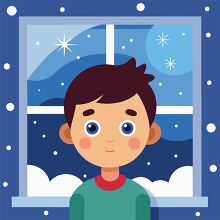 cute boy standing by a window with a snowy night outside