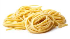 Bundles of uncooked chelentanib pasta arranged in a stack