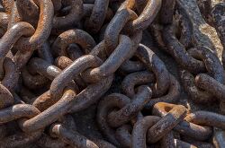 Close up of intertwined rusty metal chains