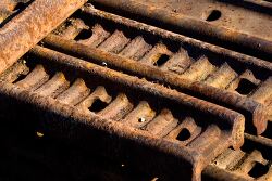 Close up of rusty metal tracks with detailed texture
