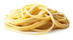 Fresh yellow chelentanib pasta with a smooth flat ribbon shape