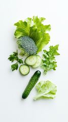 healthy assortment of leafy greens cucumber slices and broccoli