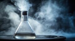 Mysterious laboratory experiment with glass flask emitting vapor and smoke in a dark environment