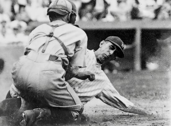 baseball player agged out at home plate