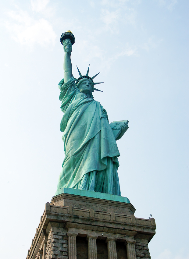 iconic statue of liberty standing tall against a clear sky