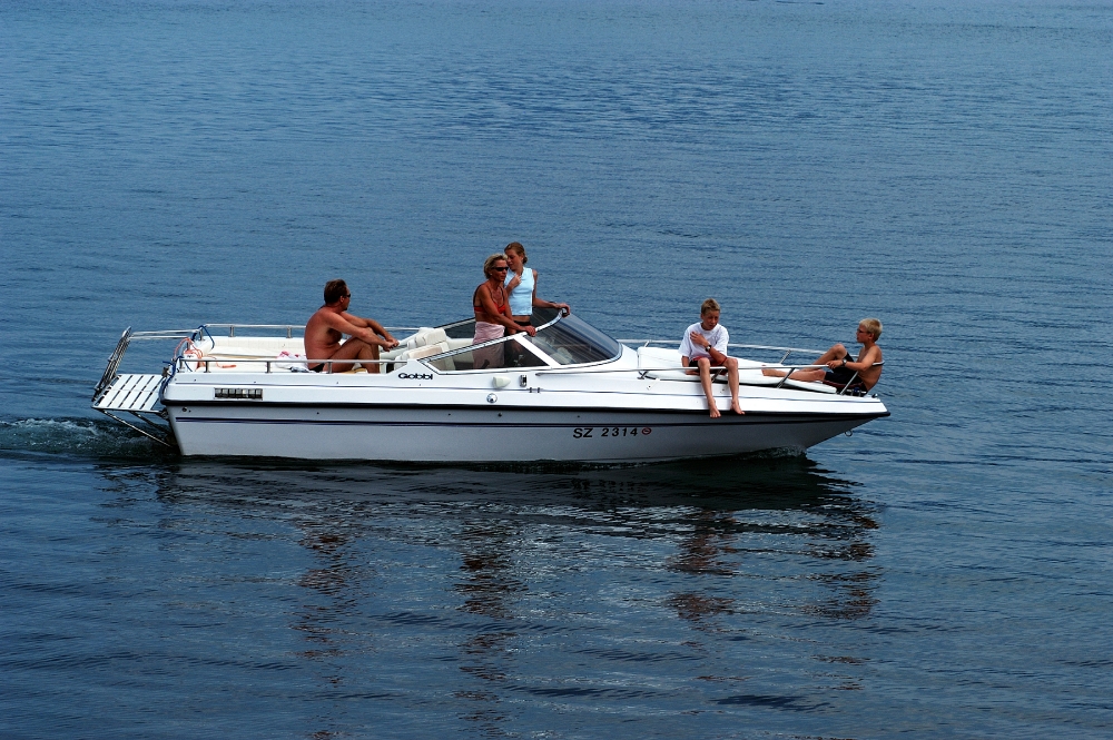 People enjoying boat on lake in Switzerland