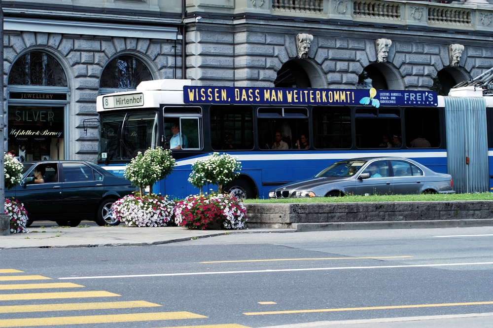 Switzerland traffic with bus along city streets