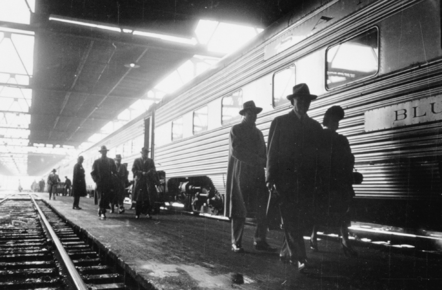 Walking along a platform next to a train