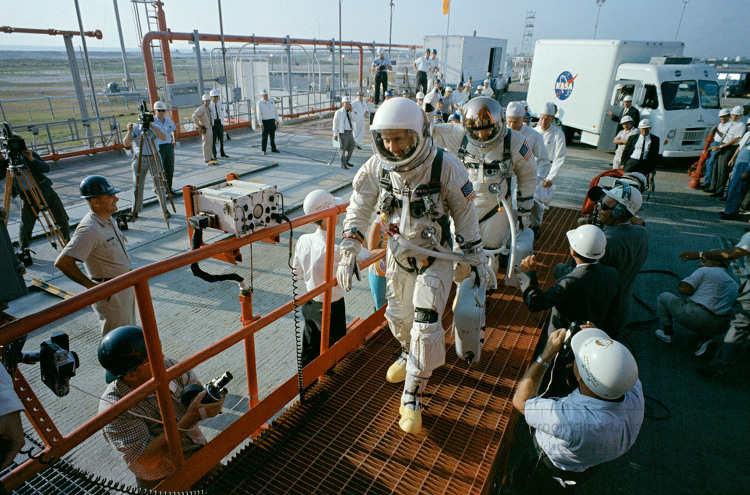 walking up the ramp toward the elevator at Pad 19 during a wet m