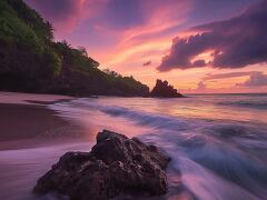 Breathtaking Sunset View Over the Tranquil Beach Rocks