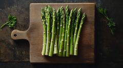 Fresh Asparagus Arranged on a Rustic Wooden Board