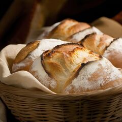 Freshly Baked Bread in a Rustic Basket on Display