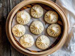 Freshly Steamed Baozi Dumplings in a Bamboo Basket