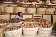 Market Vendor Sells Dried Fruits in Aswan Egypt