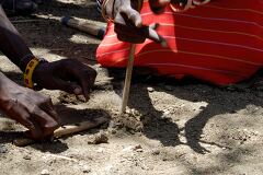 Samburu Villager Demonstrates Fire Making Technique in Kenya