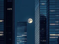 Urban Skyline Illuminated by a Serene Full Moon