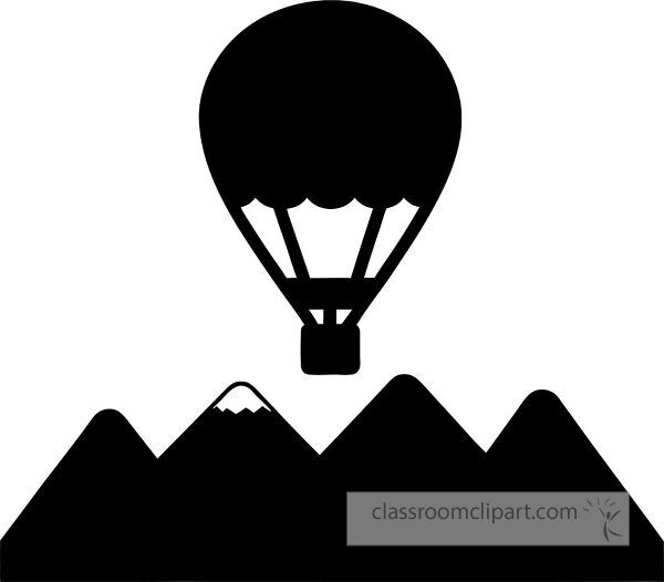 A silhouette of a hot air balloon above a mountain range