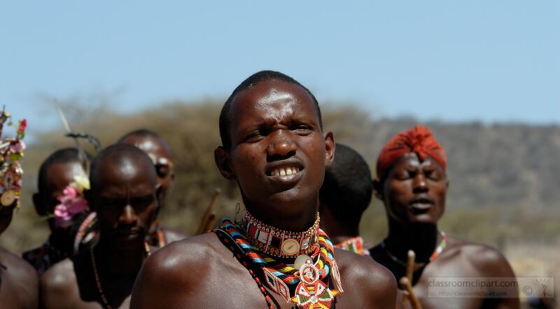 Members of the Samburu Tribe engage in traditional festivities in rural Kenya showcasing their vibrant clothing jewelry and elaborate body decorations The event highlights their rich customs and social bonds under the African sun