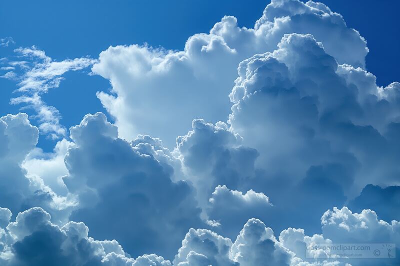 Majestic cumulonimbus clouds dominate the blue sky showcasing a vivid cloudscape with puffy white formations. The warm sunlight enhances the beauty of this natural display.