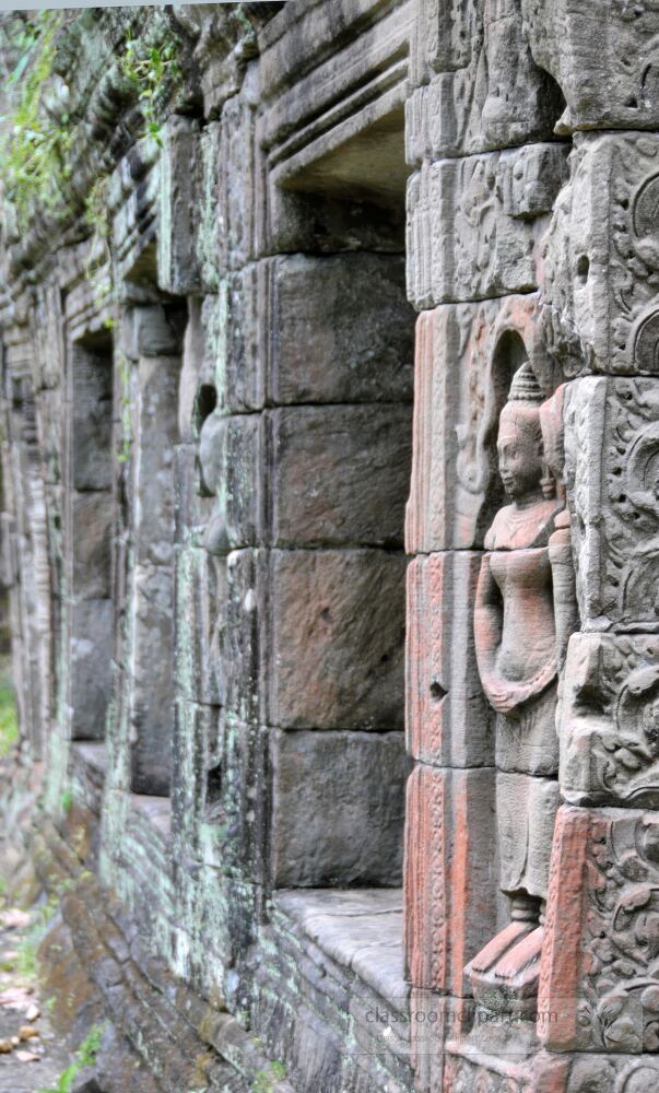 Intricate stone carvings depict elegant figures along the weathered walls of Angkor Wat in Siem Reap Cambodia inviting visitors to discover the rich history and artistry of this ancient temple complex.