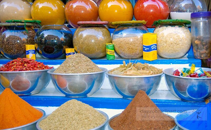 Vibrant jars of spices line a market stall in Aswan showcasing a variety of colorful ingredients Customers browse the fragrant spices during a sunny afternoon in this bustling location