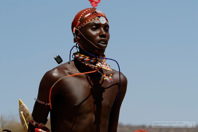 A Samburu warrior stands proudly in traditional attire adorned with colorful beads and jewelry This vibrant display reflects the rich cultural heritage of the Samburu Tribe in Kenya highlighting their unique customs and vibrant identity