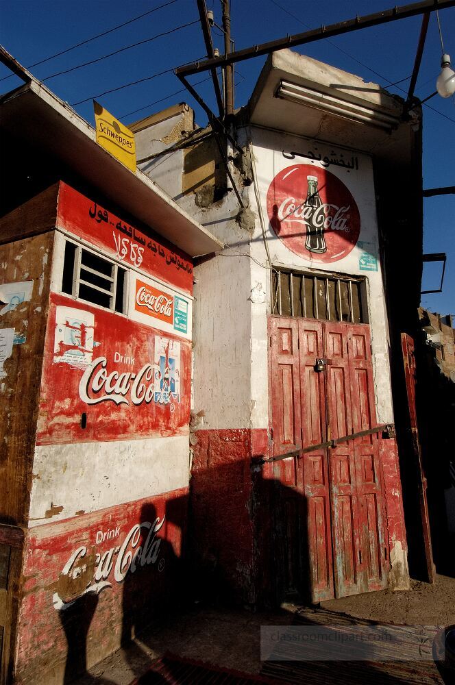 In Aswan a traditional storefront captures the essence of local life with bright colors and weathered signs The unique architecture reflects the regions rich history and culture